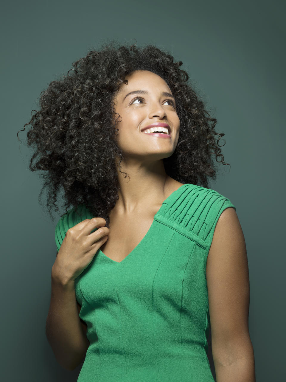 Woman smiling and looking upwards (Getty Images)