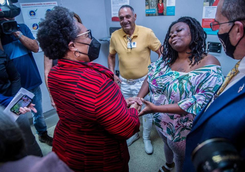 U.S. Department of Housing and Urban Development Secretary Marcia Fudge, left, talks to residents Princess Haynes and Carlos Baños during a walking tour of the Miami-Dade County Homeless Trust assistance center operated by the Chapman Partnership in downtown Miami on June 29, 2022.