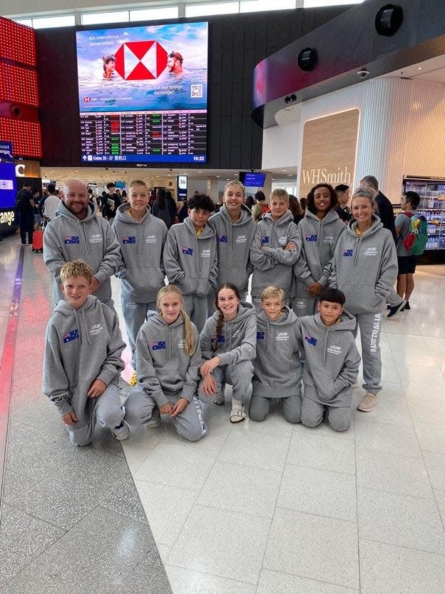 Team Australia poses for a photo on its way to the Pro Bowl.