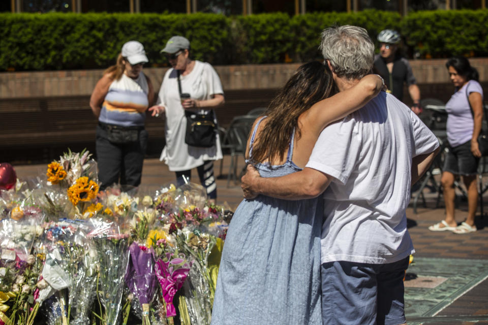 People come to mourn at memorial sites around the city center of Highland Park, Ill., on July 10, 2022. (Jim Vondruska / Getty Images)