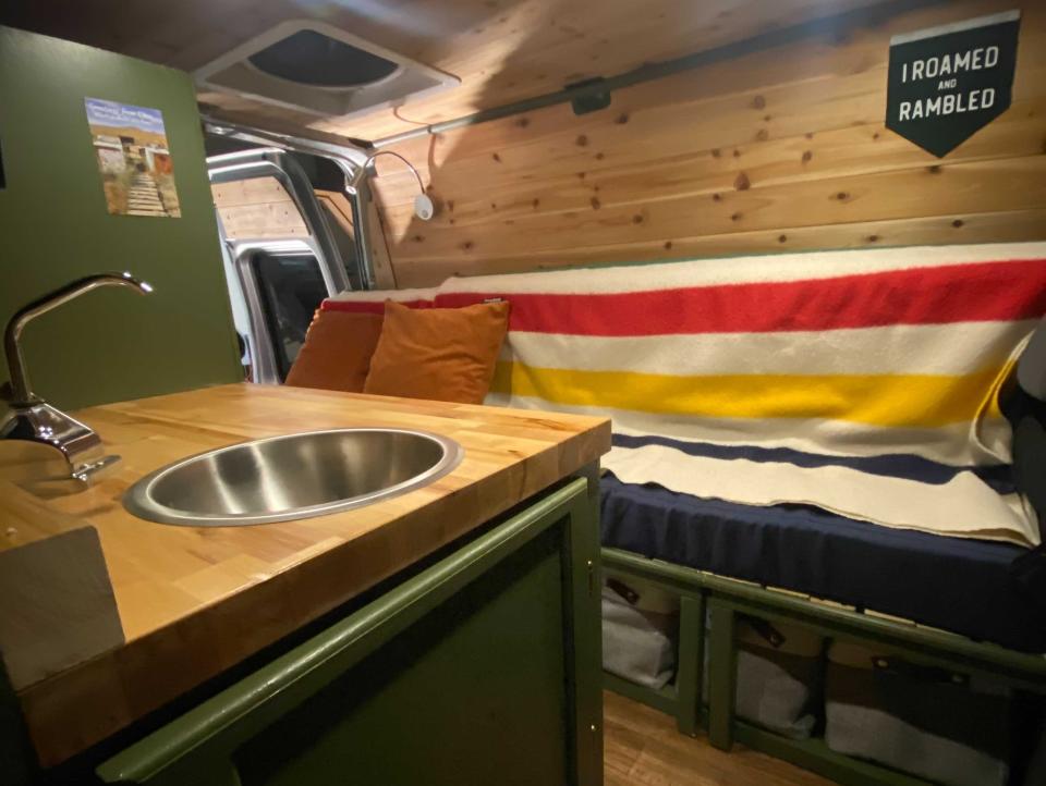 interior shot of abbey's van with sink and couch