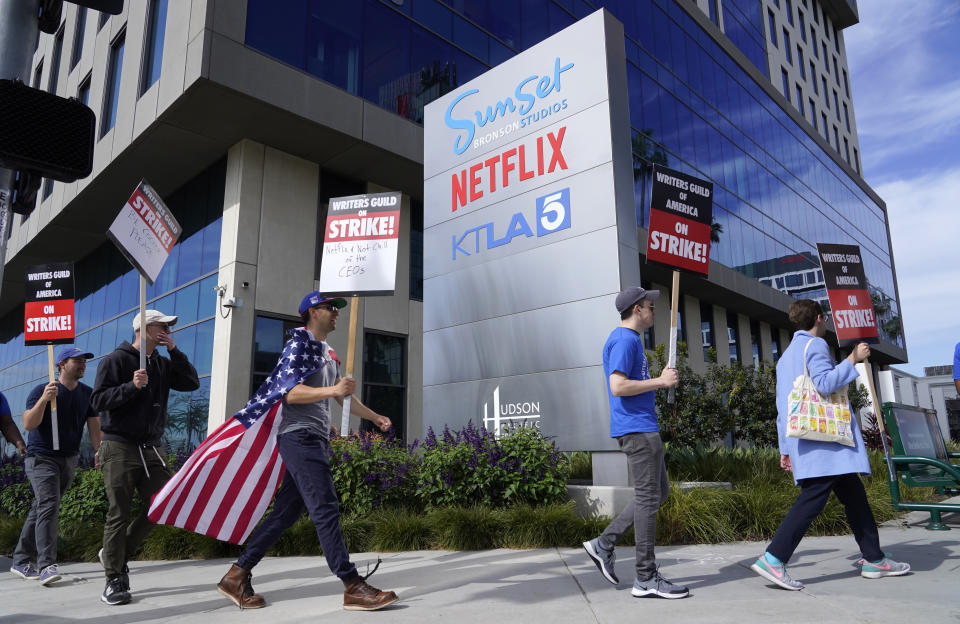 Striking writers rally in front of Netflix offices, Wednesday, May 3, 2023, in Los Angeles. Television and movie writers launched a strike Tuesday in a fight over fair pay in the streaming era. (AP Photo/Chris Pizzello)