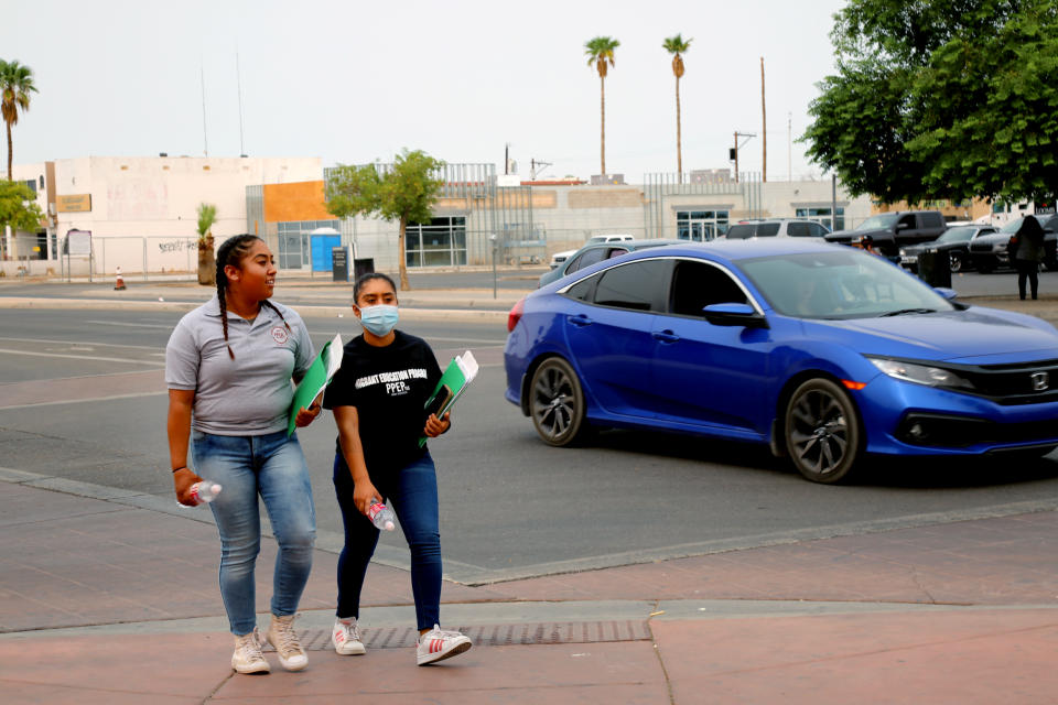 Jimena and Leslie Aguilar, 15, make their way across the Arizona/Mexico border to visit their parents in San Luis Rio Colorado in Sonora, Mexico. (Christine Romo / NBC News)