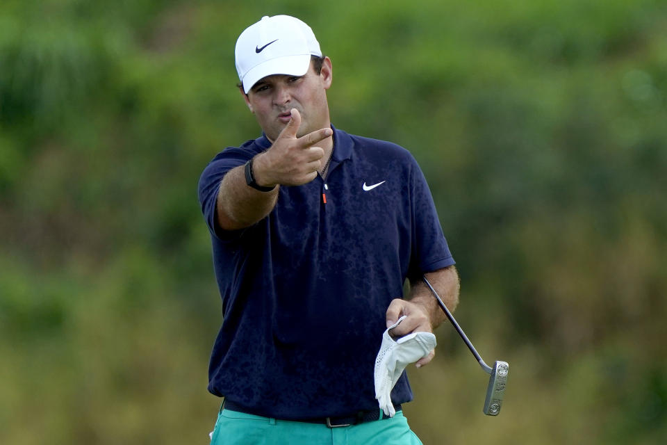 Patrick Reed looks at the lie on the 18th green after missing his birdie putt during second round of the Tournament of Champions golf event, Friday, Jan. 3, 2020, at Kapalua Plantation Course in Kapalua, Hawaii. (AP Photo/Matt York)