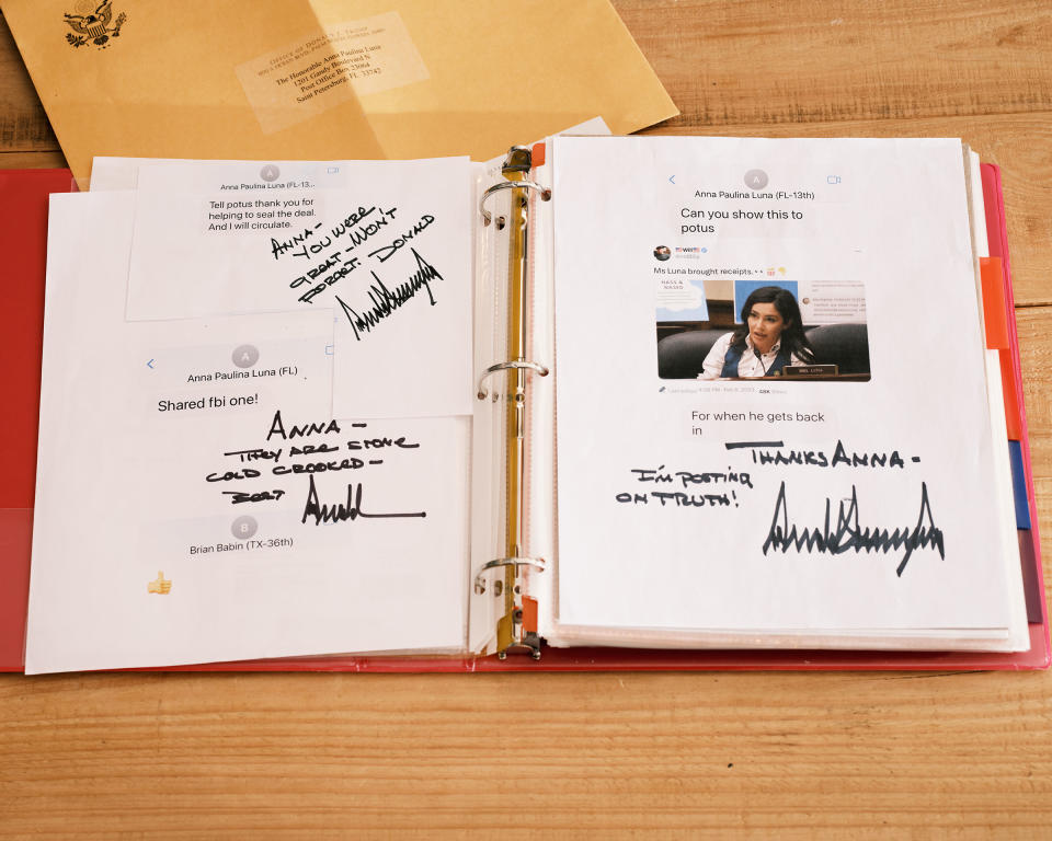 A binder full of handwritten messages and letters from President Donald Trump is seen at Luna’s home in Florida.<span class="copyright">Zack Wittman for TIME</span>