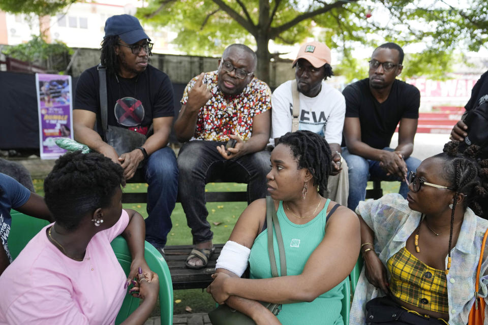 Leo Igwe, a founder of the humanist association, center, speaks during a meeting with atheists members at a park in Lagos, Nigeria. Sunday, Aug. 27, 2023. Nonbelievers in Nigeria said they perennially have been treated as second-class citizens in the deeply religious country whose 210 million population is almost evenly divided between Christians dominant in the south and Muslims who are the majority in the north. Some nonbelievers say threats and attacks have worsened in the north since the leader of the Humanist Association of Nigeria, Mubarak Bala, was arrested and later jailed for blasphemy. (AP Photo/Sunday Alamba)