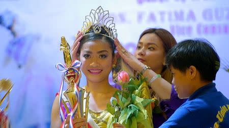 Filipina domestic helper Cyril Goliava (C) is seen in the documentary 'Sunday Beauty Queen' film during an annual beauty peageant in Hongkong in this undated handout image. Voyage Studios/Handout via Reuters