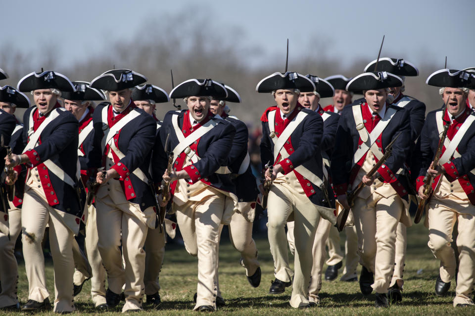 Members of Alpha Company, 3d U.S. Infantry Regiment (The Old Guard), charge during a movement demonstration on the Bowling Green of George Washington's Mount Vernon on Monday, Feb. 19, 2024, in Mount Vernon, Va. (AP Photo/Kevin Wolf)