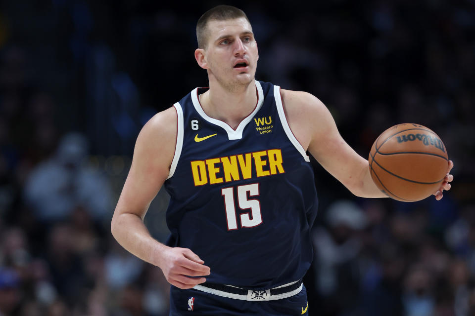 DENVER, COLORADO - JANUARY 05: Nikola Jokic #15 of the Denver Nuggets brings the ball down the court against the Los Angeles Clippers in the first quarter at Ball Arena on January 05, 2023 in Denver, Colorado. NOTE TO USER: User expressly acknowledges and agrees that, by downloading and/or using this photograph, User is consenting to the terms and conditions of the Getty Images License Agreement. (Photo by Matthew Stockman/Getty Images)