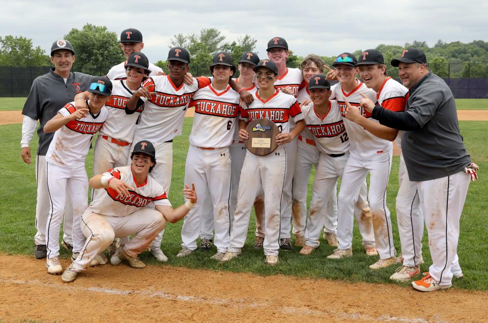 The Tuckahoe baseball team pose with the regional plaque after the Tuckahoe High School and Port Jefferson High School boys baseball Class C Regional Final game at John Jay High School in Cross River, June 3, 2023. Tuckahoe beat Port Jefferson 8-7. 