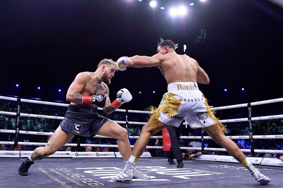 Paul, left, knocked down Tommy Fury late in their fight but lost on points (AP)