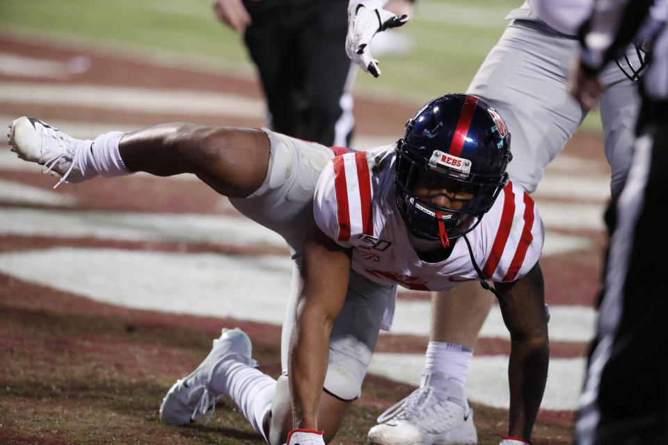 Mississippi wide receiver Elijah Moore (8) celebrates after scoring a touchdown against Mississippi State on Thursday. The act resulted in a 15-yard penalty assessed on the extra point, which was missed. (AP)