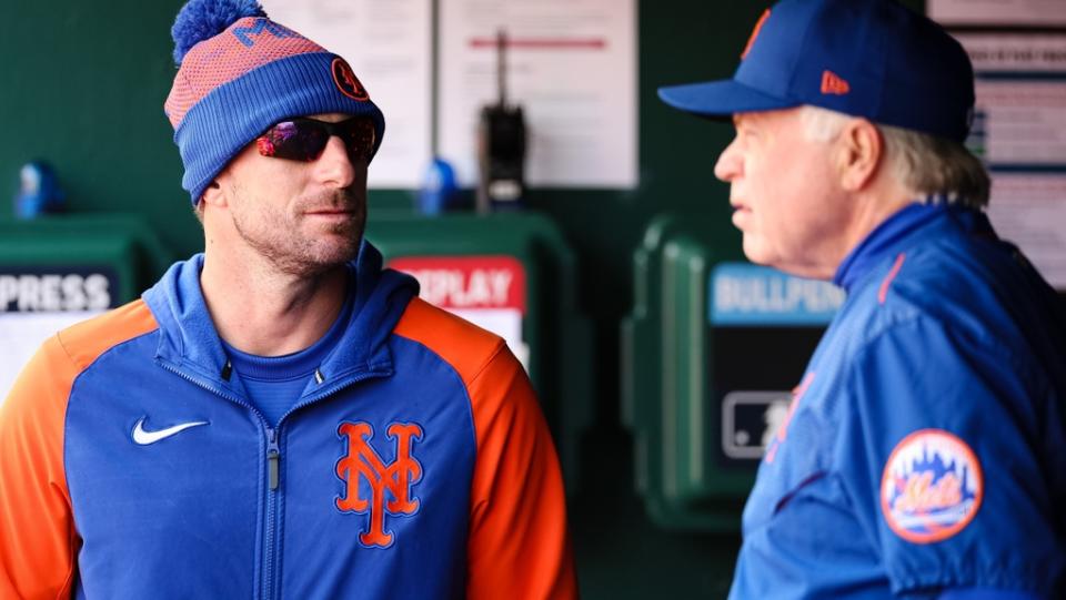 Apr 10, 2022; Washington, District of Columbia, USA; New York Mets relief pitcher Max Scherzer (21) speaks with New York Mets manager Buck Showalter (11) in the dugout during the fifth inning of the game against the Washington Nationals at Nationals Park.