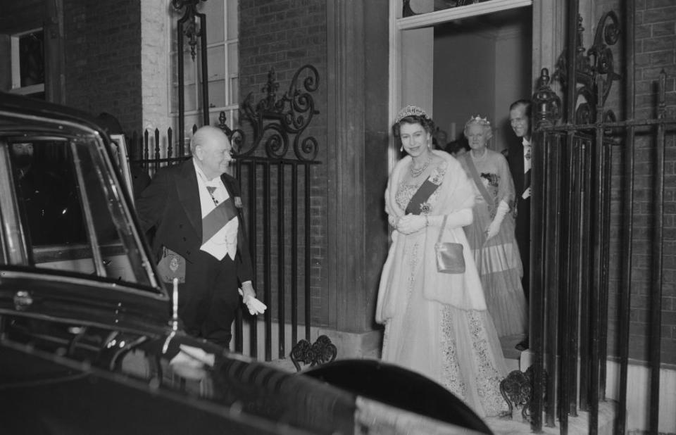 Queen Elizabeth II and Prince Philip leave 10 Downing Street in London after having dinner with Sir Winston Churchill (1874 - 1965), the British Prime Minister and his wife.   (Photo by Fox Photos/Getty Images)