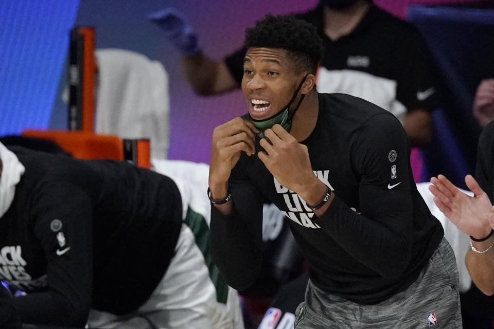 Milwaukee Bucks' Giannis Antetokounmpo shouts from the bench in the second half of an NBA conference semifinal playoff basketball game against the Miami Heat Tuesday, Sept. 8, 2020 in Lake Buena Vista, Fla. (AP Photo/Mark J. Terrill)