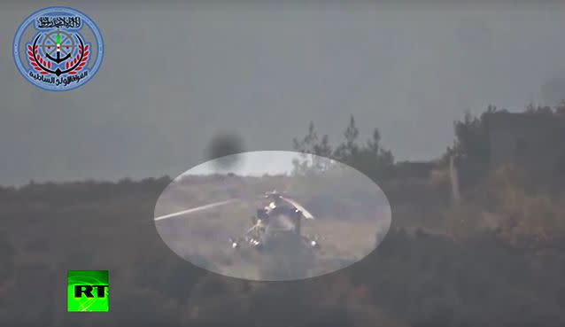 The video shows the helicopter sitting on a hill before rocket impact.