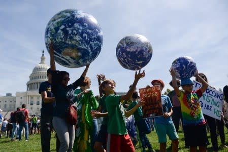 Young protesters participate in a rally near the U.S. Capitol as part of the D.C. Climate Strike March to demand action on climate change in Washington