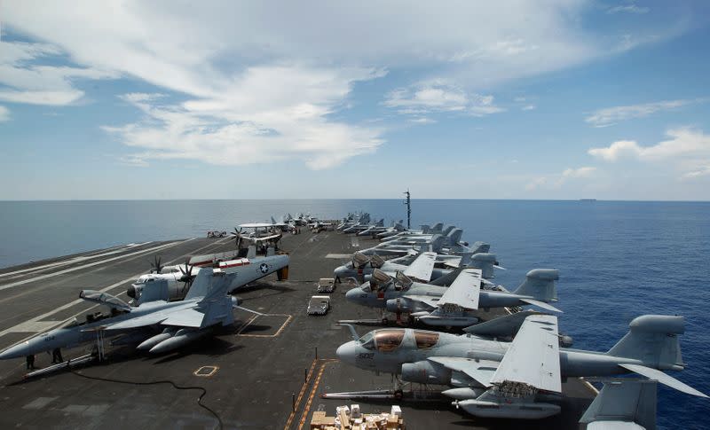 FILE PHOTO: A general view of the aircrafts on the flight deck during a tour of the USS Nimitz aircraft carrier on patrol in the South China Sea