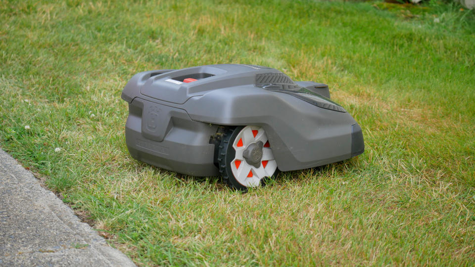 Husqvarna Automower 450XH EPOS robotic lawn mower cutting lawn.