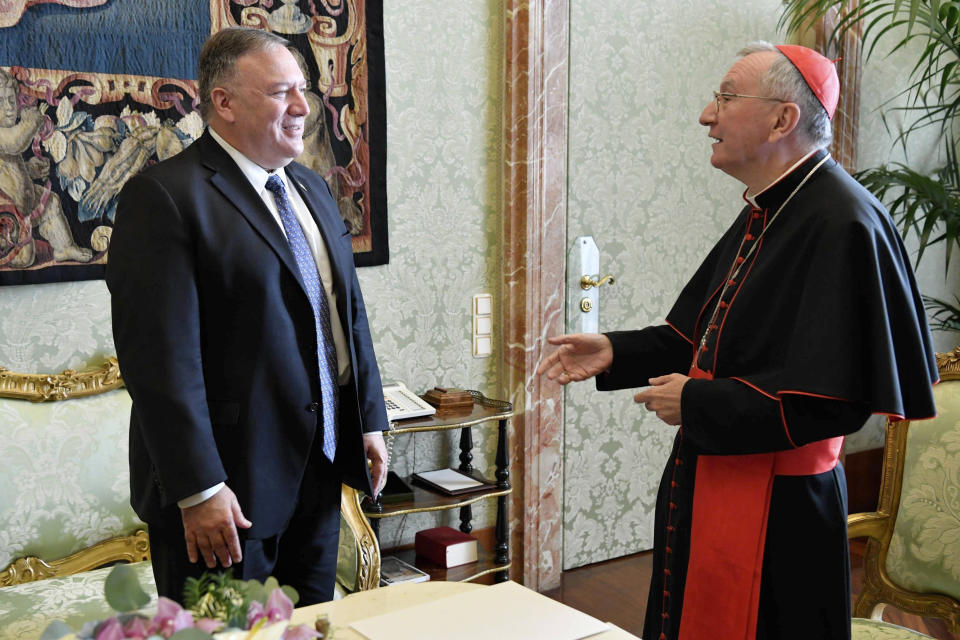 U.S. Secretary of State Mike Pompeo meets Vatican Secretary of State Cardinal Pietro Parolin, at the Vatican, Thursday, Oct. 1, 2020. Pompeo is meeting Thursday with top Vatican officials, a day after tensions over U.S. opposition to the Vatican’s China policy spilled out in public. (Vatican Media via AP)