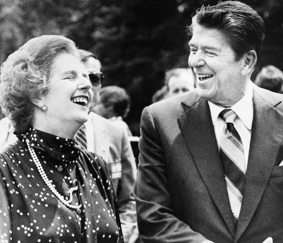 FILE - U.S. President Ronald Reagan, right, and Britain's Prime Minister Margaret Thatcher, laugh together during a break from a session at the Ottawa Summit in this file photo dated July 21, 1981, at Government House in Ottawa, Canada. Thatcher and Reagan forged a close alliance in the midst of the Cold War, with the prime minister once telling students that the Republican president's “really good sense of humor” helped their relationship. (AP Photo/File)