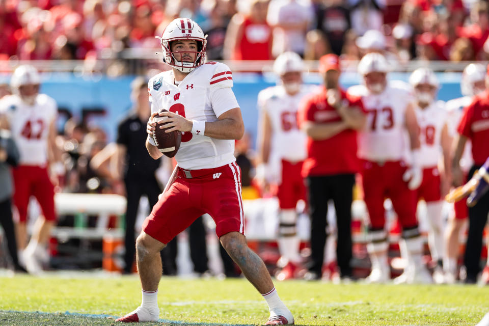 Jan. 1, 2024; Tampa; Wisconsin Badgers quarterback Tanner Mordecai (8) looks to throw during the first half against the LSU Tigers at Raymond James Stadium. Matt Pendleton-USA TODAY Sports