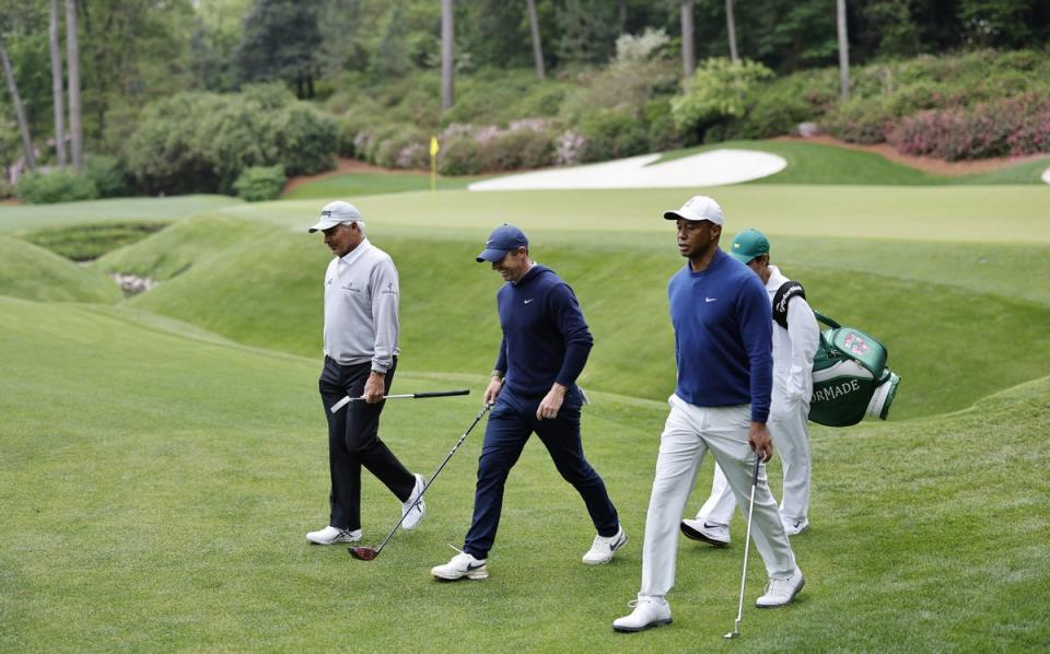 Rory McIlroy practicing at Augusta with Fred Couples and Tiger Woods (EPA)