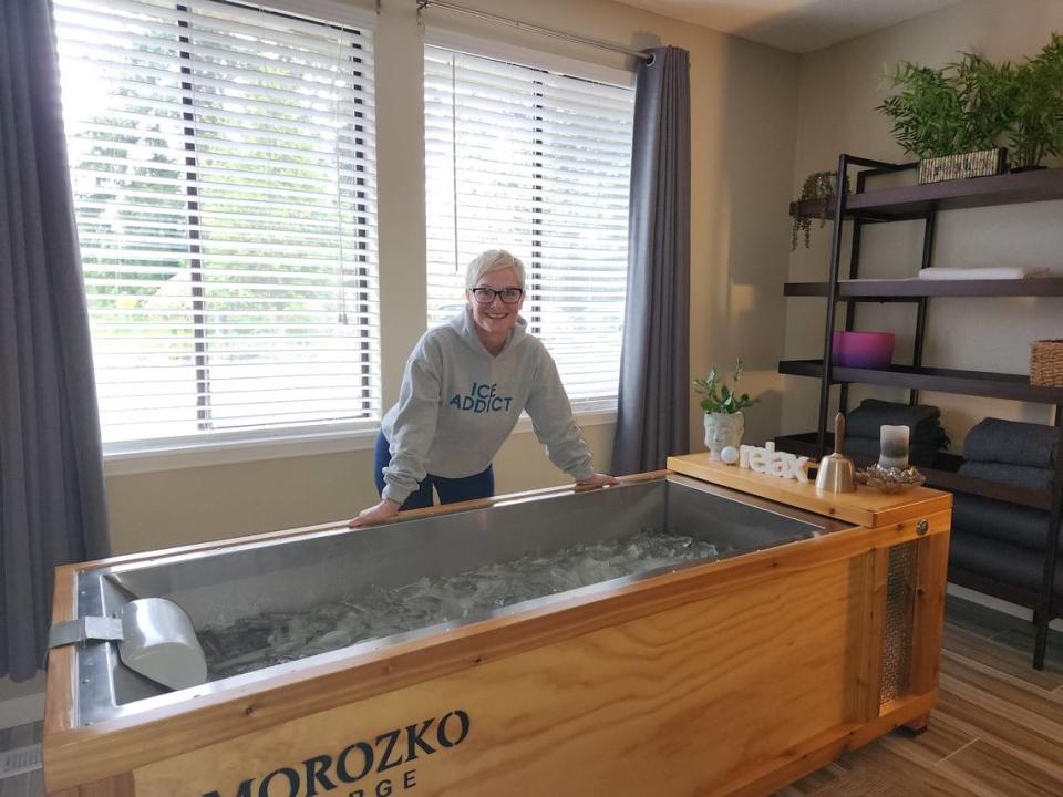 Puget Sound Plungers group founder Renate Rain stands behind her in-home ice bath on May 1, 2023, in University Place. The ice bath produces its own slabs of ice, which Rain smashes up with a metal rod. The water’s temperature hovers around 34 degrees Fahrenheit.