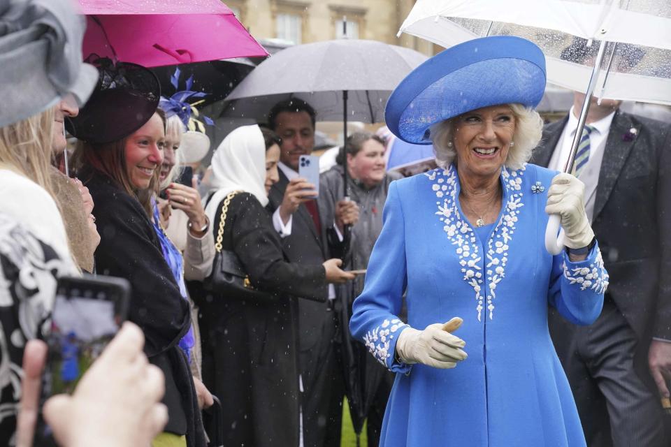 FILE - Britain's Camilla, the Duchess of Cornwall attends the annual Royal Garden Party, held at Buckingham Palace, in London, Wednesday May 11, 2022. (Jonathan Brady/Pool Photo via AP, File)