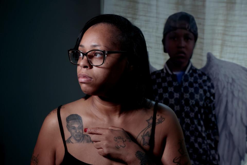 Casandra Jones has a tattoo of her son, Zyair Harris, on her chest. Zyair was killed by oncoming traffic in April 2022 after his school bus driver failed to deploy the vehicle's safety stop sign and lights. The driver, Debra White, was supposed to drop him off in front of their home, Jones said, so the 13-year-old, who had autism spectrum disorder, wouldn't have to cross.