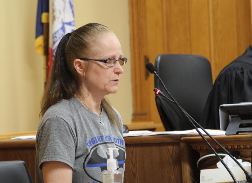 Kathy Smith speaks from the witness stand during Michael Lang's sentencing hearing at the Grundy County Courthouse in Grundy Center.