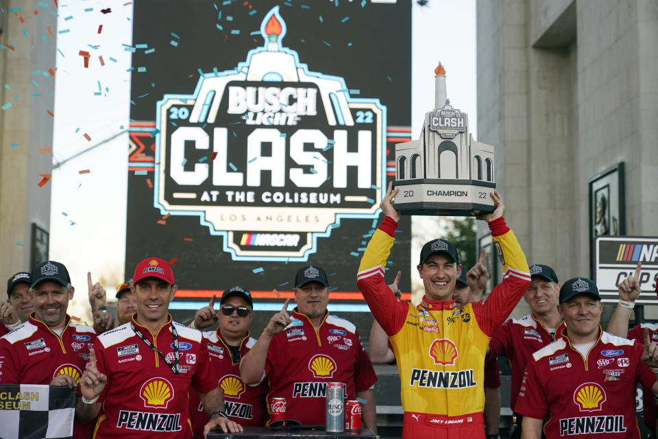 Joey Logano celebrates after winning a NASCAR exhibition auto race at Los Angeles Memorial Coliseum, Sunday, Feb. 6, 2022, in Los Angeles. (AP Photo/Marcio Jose Sanchez)