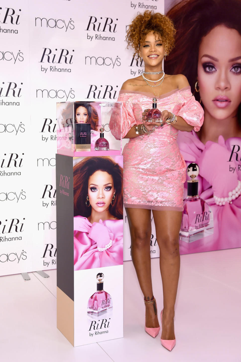 Rihanna wears a lacy pink mini dress at the RiRi by Rihanna fragrance unveiling at Macy’s on Aug. 31, 2015 in Brooklyn, New York.