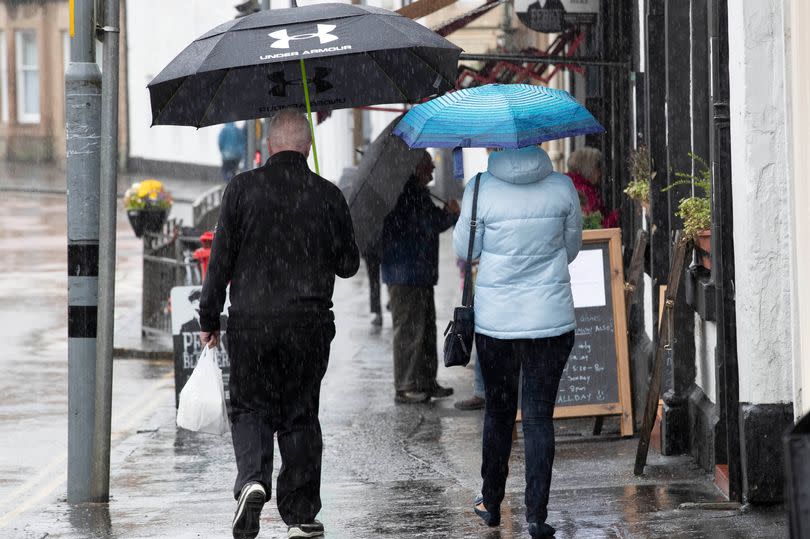 General Views of a high River Teith and People out and about Callandar in the trossachs as Heavy Rain and Flooding grips Scotland.