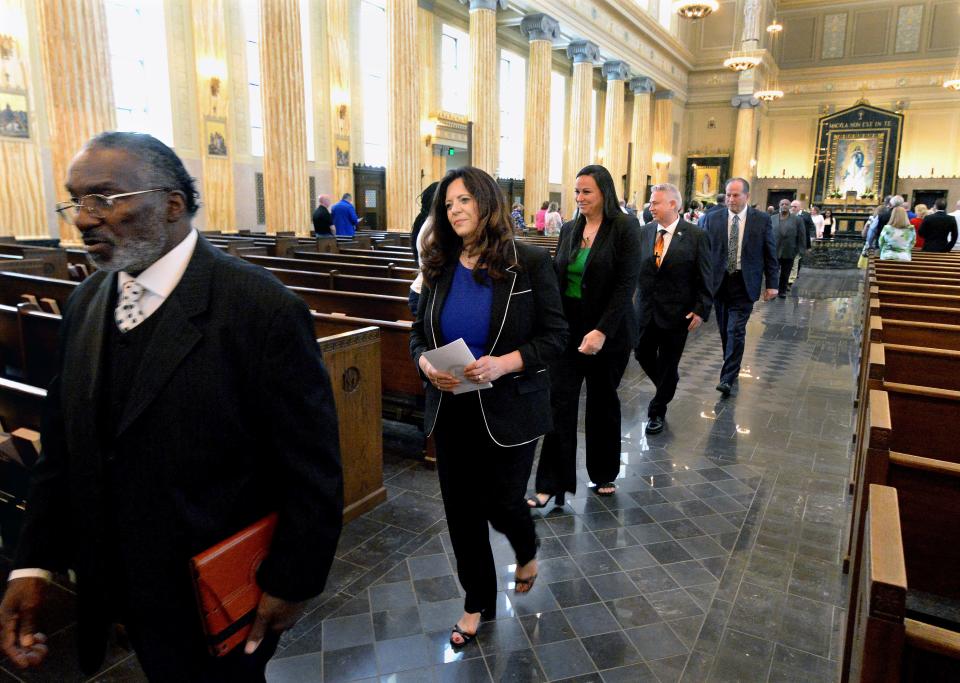 Mayor-Elect Misty Buscher, center front, processes out of the Cathedral of the immaculate Conception with other elected officials following an ecumenical prayer service on Friday, May 5, 2023. It was the start of Friday's Inauguration Day activities.