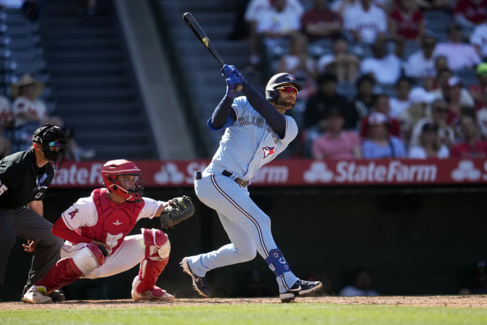Toronto Blue Jays' Kevin Kiermaier follows through on an RBI double during the 10th inning of a baseball game Los Angeles Angels Sunday, April 9, 2023, in Anaheim, Calif. (AP Photo/Marcio Jose Sanchez)