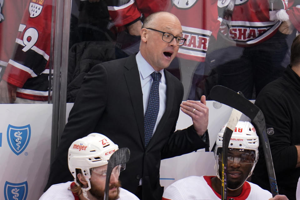 FILE - Detroit Red Wings head coach Jeff Blashill, top center, gives instructions during the third period of an NHL hockey game against the Pittsburgh Penguins in Pittsburgh, Friday, Jan. 28, 2022. Former Detroit Red Wings coach Jeff Blashill is joining the Tampa Bay Lightning as an assistant. Lightning general manager Julien BriseBois announced the move Tuesday, July 12, 2022. (AP Photo/Gene J. Puskar, File)