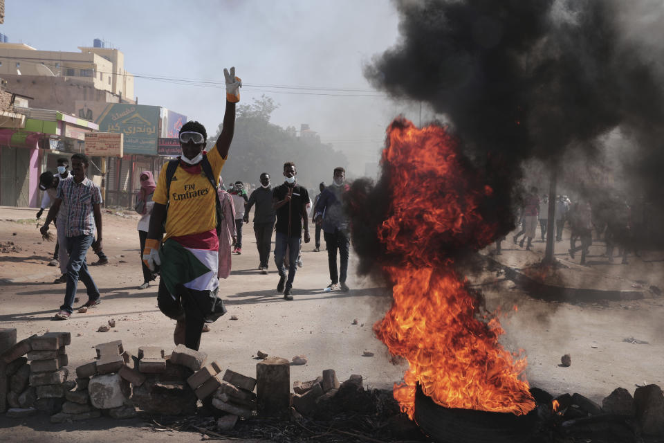 A man chants slogans during a protest to denounce the October military coup,, in Khartoum, Sudan, Thursday, Dec. 30, 2021. The October military takeover upended a fragile planned transition to democratic rule and led to relentless street demonstrations across Sudan. (AP Photo/Marwan Ali)