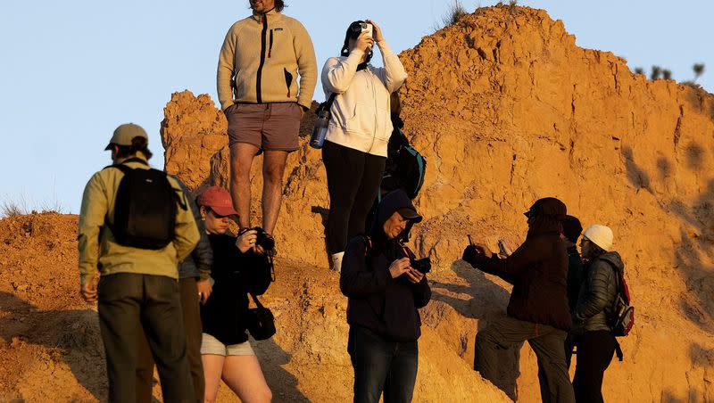 People watch the sunrise at Bryce Canyon National Park on May 18. Utah’s tourism industry generated nearly $12 billion in visitor spending last year, according to recent data.