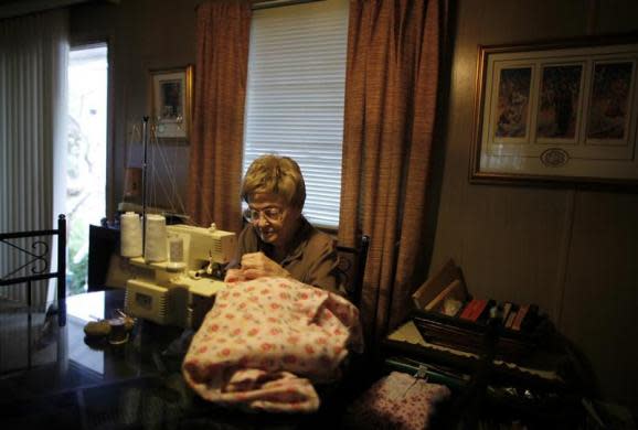 June Manning, 84, sews in her trailer home in which she has lived for 18 years, in Village Trailer Park in Santa Monica, July 12, 2012. The trailer park was built in 1951, and 90 percent of its residents are elderly, disabled or both, according to the Legal Aid Society. The property is valued at as much as $30 million, according to the LA Times.
