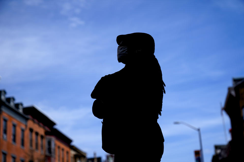 An immigrant from Liberia, who spoke to The Associated Press on condition of anonymity, poses for a photograph in the United States on Friday, March 12, 2021. She says she lives in fear, afraid both of being deported and of retribution after she testified against men who were convicted of killing her boyfriend. She has waited years for a U visa, carved out for people without legal status who become victims of serious crimes — or in some cases, witnesses — and help law enforcement solve them. But the program is broken, immigrant advocates say, leaving applicants waiting years for a decision. (AP Photo/Matt Rourke)