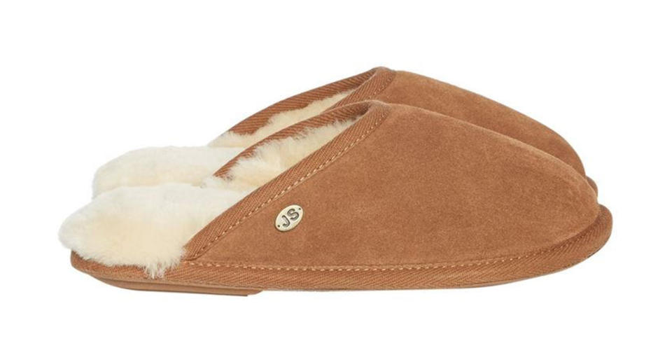 Cosy slippers in winter are a must - this is the UK we live in, after all. Warm your mum's toes with this snug sheepskin pair, which, happily, are on sale. <a href="https://fave.co/31aivGn" rel="noopener" target="_blank" data-ylk="slk:Shop now.;elm:context_link;itc:0;sec:content-canvas" class="link "><strong>Shop now.</strong></a>