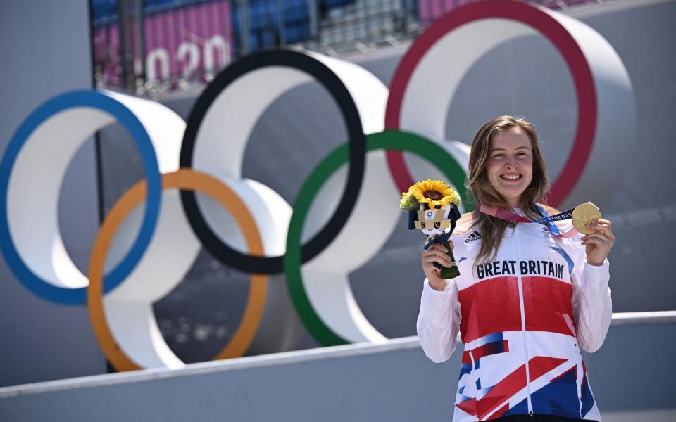 Gold medallist Britain's Charlotte Worthington stands on the podium for the victory ceremony of the cycling BMX freestyle women's park event at the Ariake Urban Sports Park during the Tokyo 2020 Olympic Games in Tokyo on August 1, 2021. - AFP