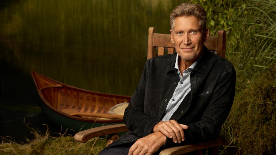 Gerry Turner poses by a boat in promo image for The Golden Bachelor