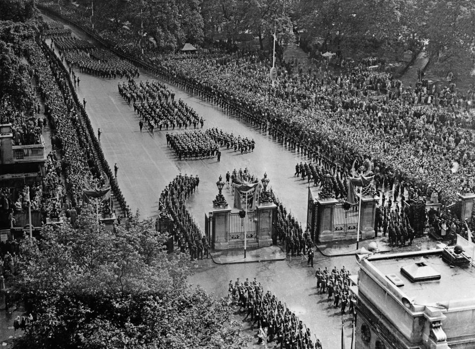 (Original Caption) In perfect formation, soldiers and sailors from the far-corners of the British Commonwealth march in the coronation procession of Queen Elizabeth II, on June 2nd. This overhead shot shows a portion of the awe-inspiring parade marching up East Carriage Drive bordering the famed Hyde Park, and passing through the Marble Archway on the return procession from Westminister Abbey.