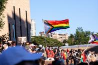 <p>A Pride flag in support of Black Lives Matter and Black Trans Lives Matter waves over a crowd in Chicago. <br></p>