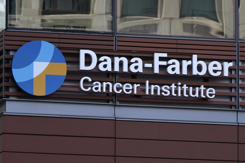 FILE - A sign hangs from the Dana-Farber Cancer Institute, Aug. 18, 2022, in Boston. Dana-Farber Cancer Institute announced it’s requesting six retractions and 31 corrections of scientific papers after a British blogger flagged problems in early January 2024. (AP Photo/Charles Krupa, File)