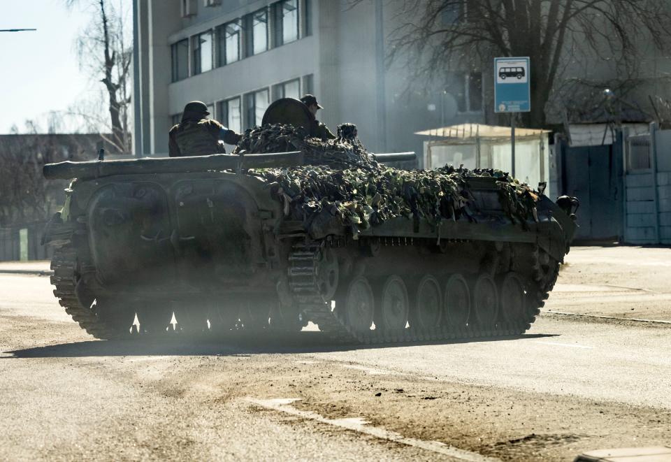 A Ukrainian military tank is seen on a road in Kyiv, on March 22, 2022. - Russians reinforce their positions around the capital which has not yet been fully surrounded on the 27th day of the assault. (Photo by FADEL SENNA / AFP) (Photo by FADEL SENNA/AFP via Getty Images)