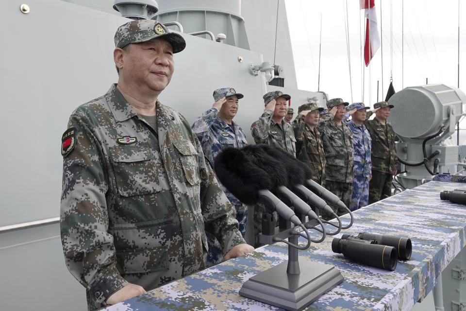 FILE - In this April 12, 2018, file photo released by Xinhua News Agency, Chinese President Xi Jinping speaks after reviewing the Chinese People's Liberation Army (PLA) Navy fleet in the South China Sea. A new Pentagon report lays out U.S. concerns about China's growing military might, underscoring worries about a possible attack against Taiwan. The report's release on Jan. 15, 2019 came just a week after Chinese President Xi Jinping called on his People's Liberation Army to better prepare for combat. (Li Gang/Xinhua via AP, File)