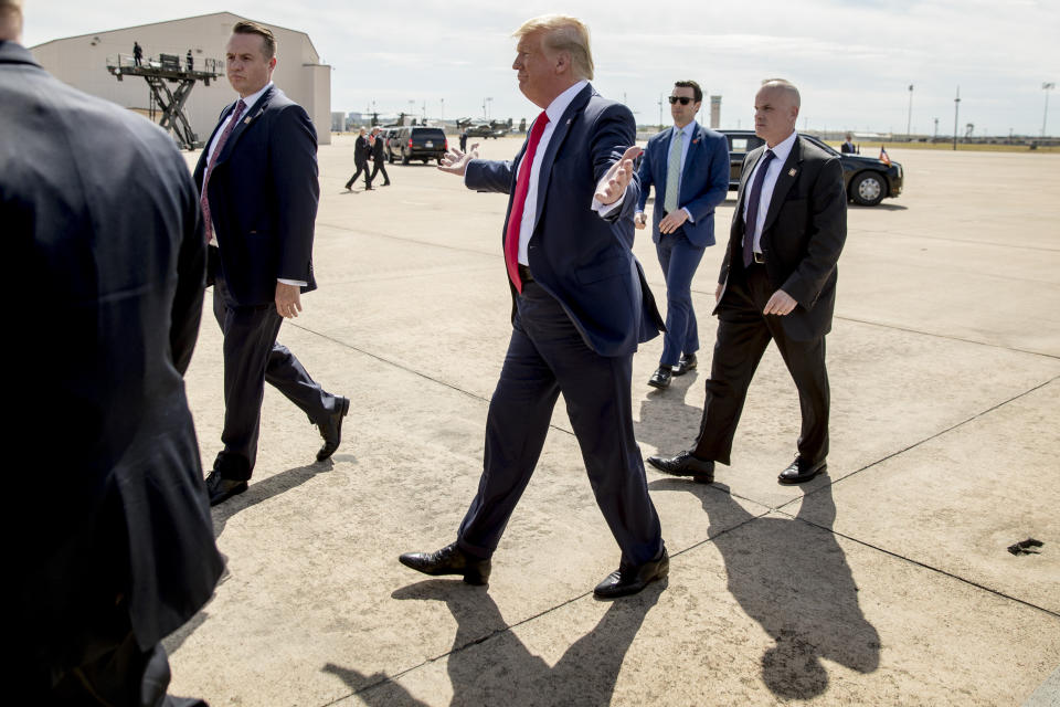 President Donald Trump gestures as he greets guests on the tarmac as he arrives at Naval Air Station Joint Reserve Base in Fort Worth, Texas, Thursday, Oct. 17, 2019. (AP Photo/Andrew Harnik)